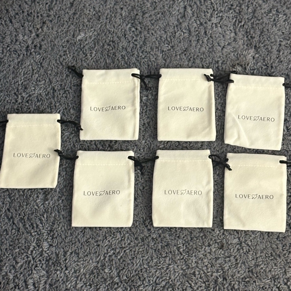 NWT set of 7 Love Aero from Louise Carter suede jewelry bags
